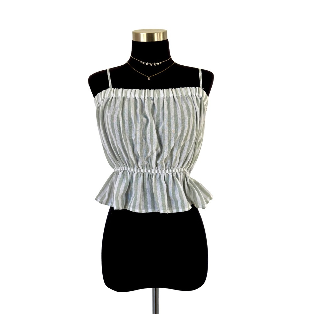 Stay effortlessly chic in this 100% cotton top with adjustable shoulder straps.